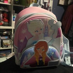 Loungefly Disney Parks FROZEN (Elsa and Anna) 
Pink and Purple Backpack